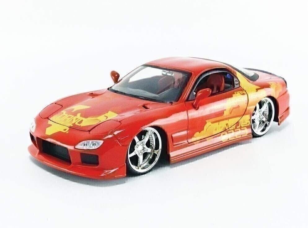 Red and yellow toy car model on a white background