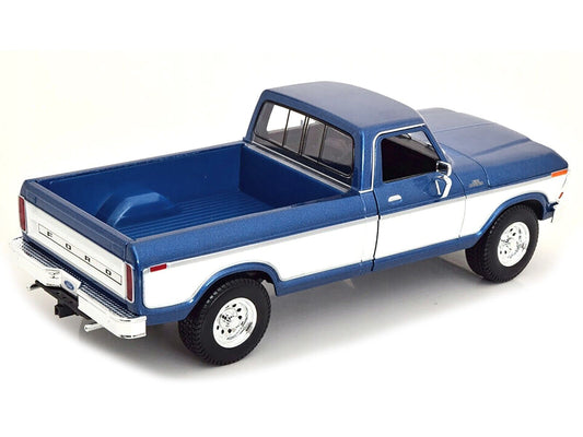 Model of a blue and white Ford truck on a white background