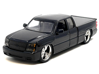 Model of a black pickup truck on a white background