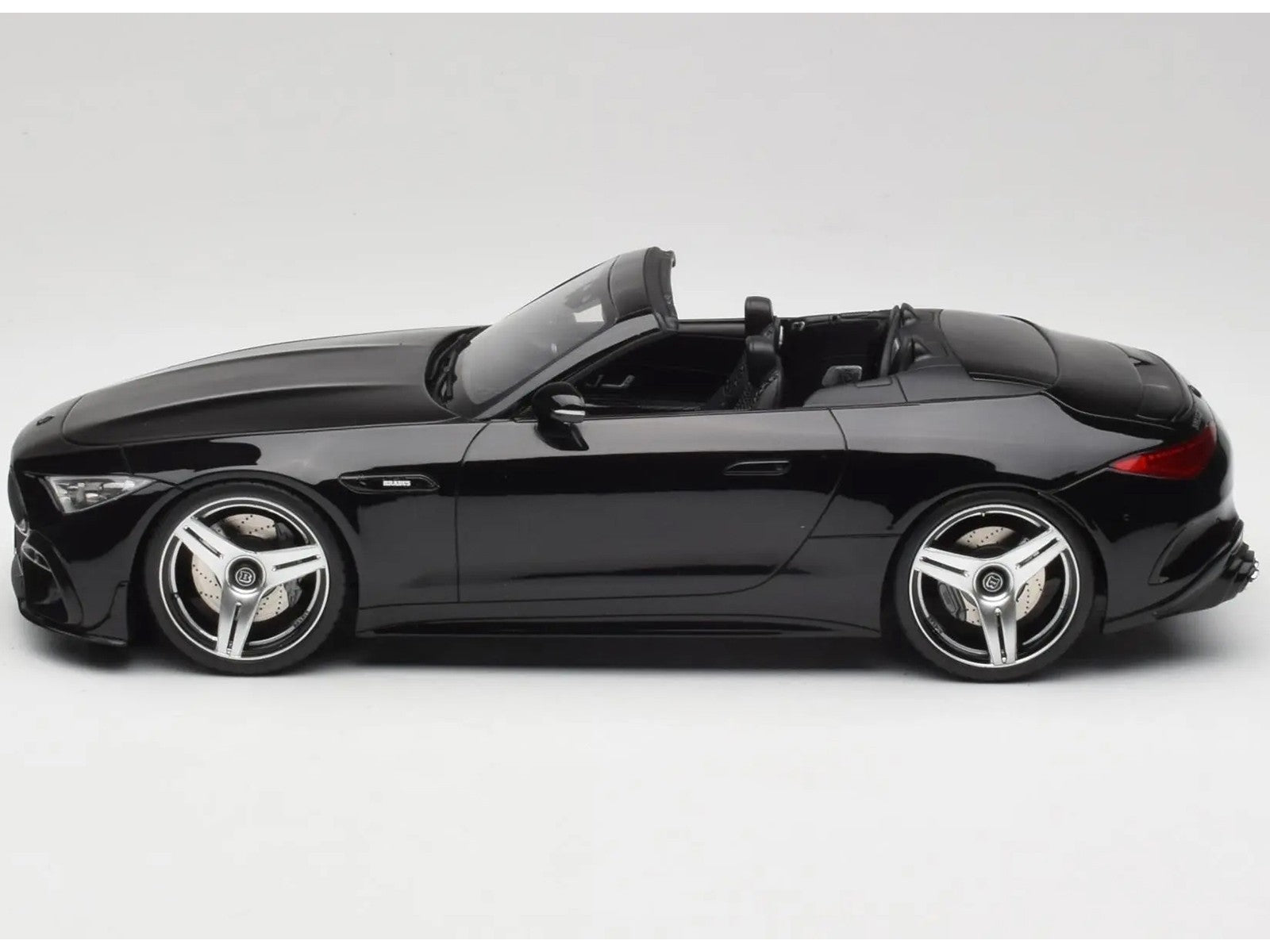 Side view of a black toy car