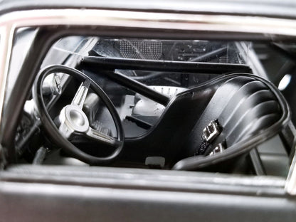 Close-up of a car's steering wheel and dashboard from inside the vehicle.