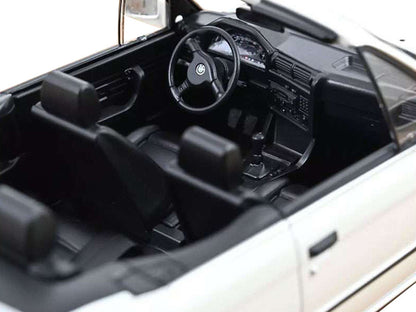Close-up of a car's interior with steering wheel and dashboard.