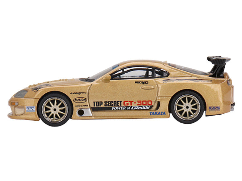 Gold toy car with branding on a white background