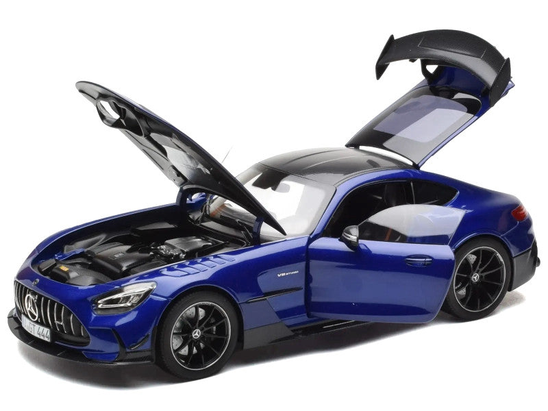 Blue model car with open doors and hood on a white background