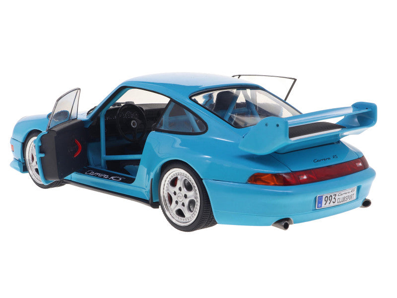 Blue model car with open door on a white background