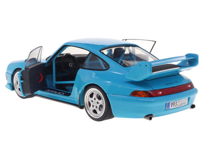 Blue model car with open door on a white background