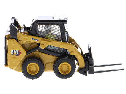 Model of a Caterpillar skid steer loader on a white background