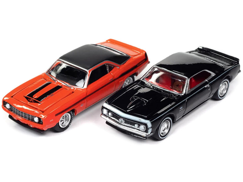 Two model cars, one red and one black, on a white background