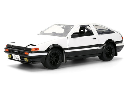 Model car of a white sports car with black stripes on a white background
