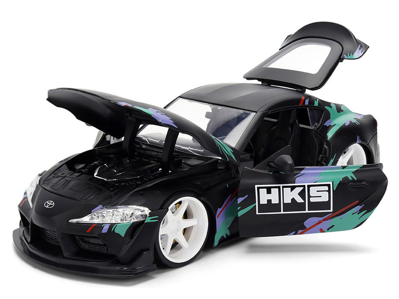 Model car with open doors on a white background
