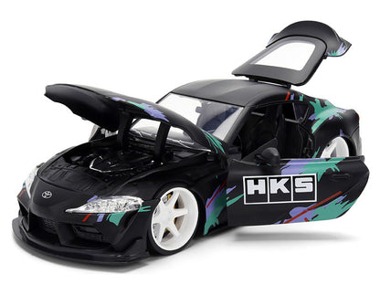 Model car with open doors on a white background