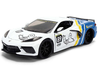 Model car with racing decals on a white background