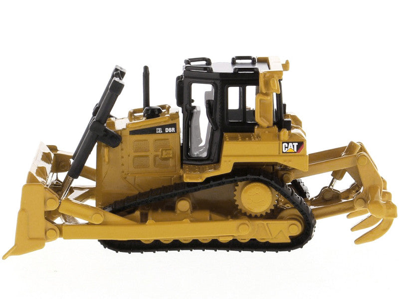 Toy bulldozer with detailed features on a white background