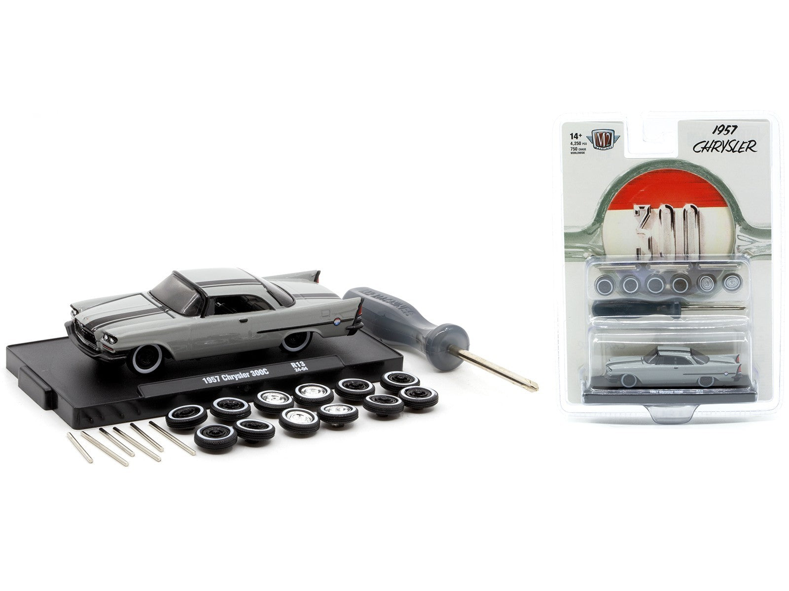 Model car kit with tools and parts on a white background