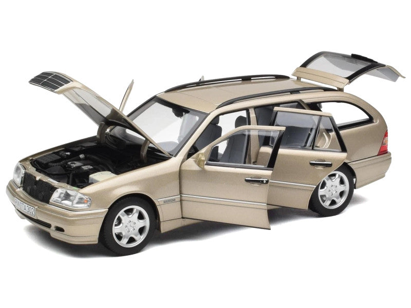 Model car with open doors and hood on a white background