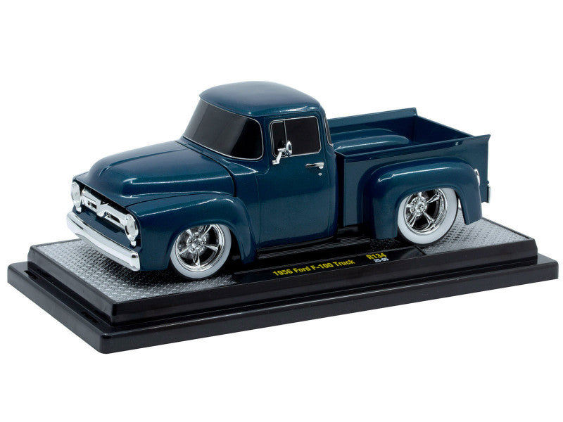 Model of a blue truck on a display stand with a white background