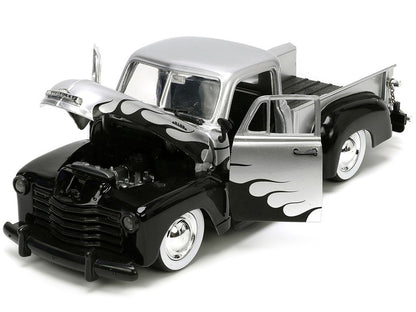 Model truck with flame design on a white background