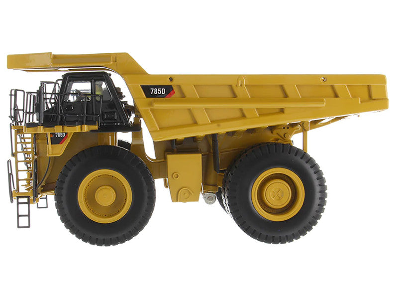 Model of a large yellow dump truck on a white background