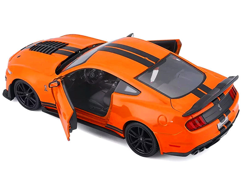 Orange toy car with open door on a white background
