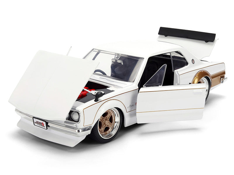 Model car with open door on a white background