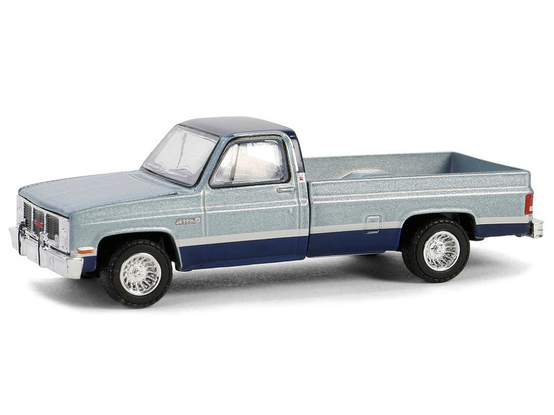 Model of a pickup truck with a blue and gray color scheme on a white background