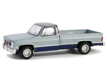 Model of a pickup truck with a blue and gray color scheme on a white background