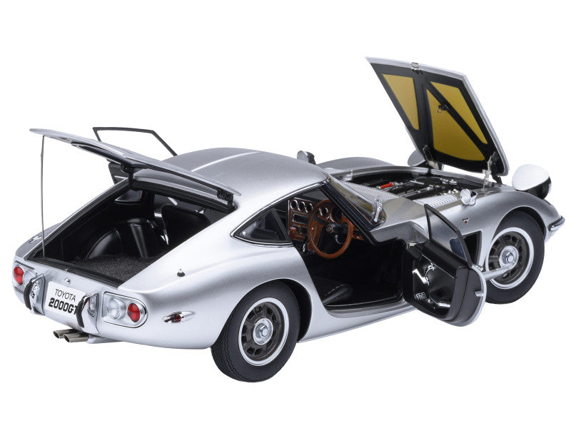 Model car with open doors and trunk on a white background
