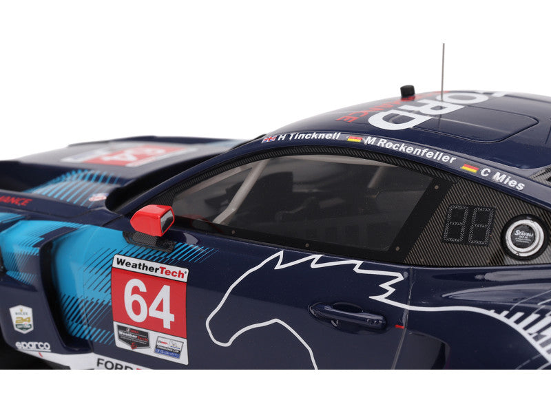 Close-up of a race car with visible branding and number 64 on a white background
