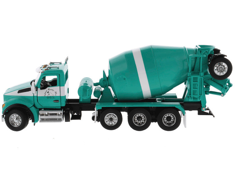 Model of a green cement mixer truck on a white background