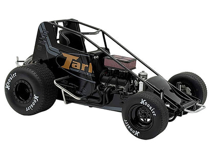 Model of a black race car with visible branding on a white background