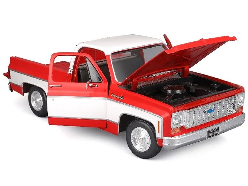 Model truck with open hood on a white background