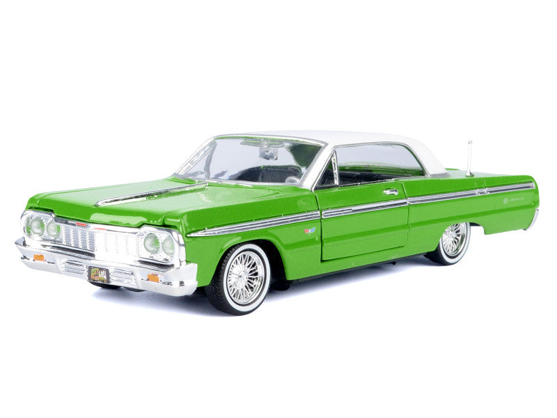 Green classic car model on a white background