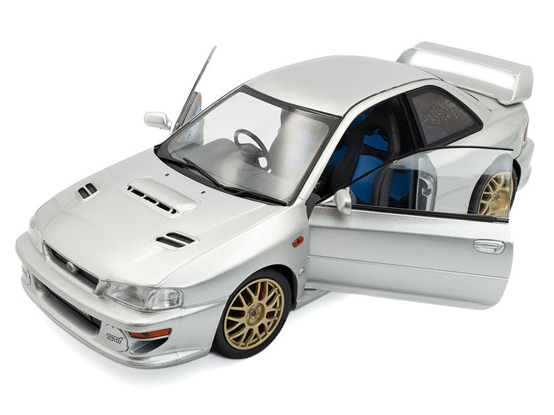 Model car with open door on a white background