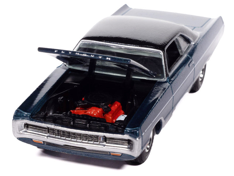 Model car with open hood showing red engine on a white background