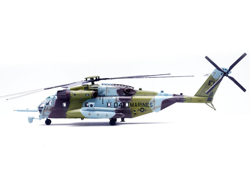 Camouflage helicopter with 'Marines' branding on a white background