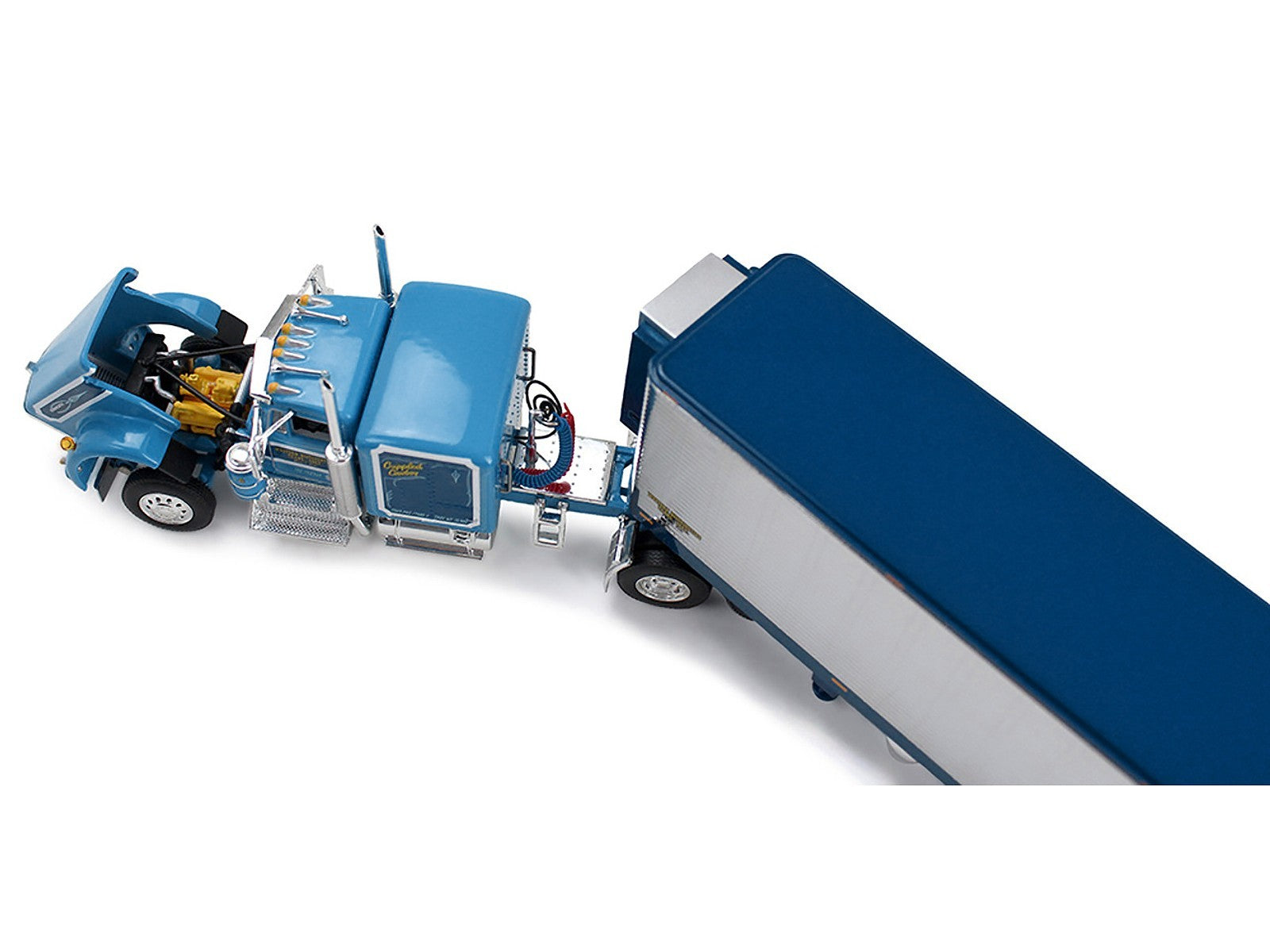Model of a blue truck with a trailer on a white background