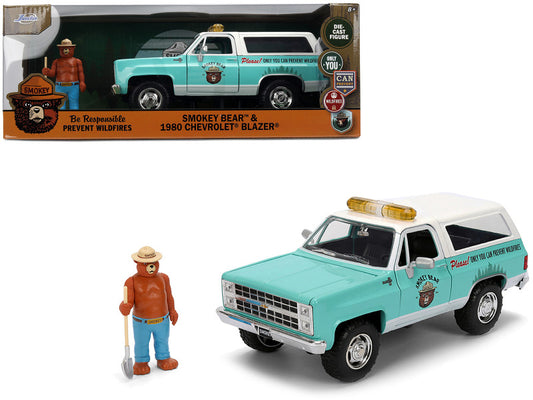 Model of a 1980 Chevrolet Blazer with Smokey Bear logo, including a figure of Smokey Bear, on a white background.