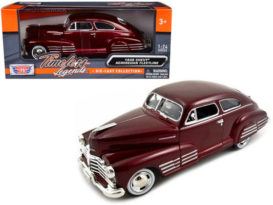 A 1/24 scale diecast model of a 1948 Chevrolet Aerosedan Fleetline in dark red metallic color, with the original packaging showing the model details.