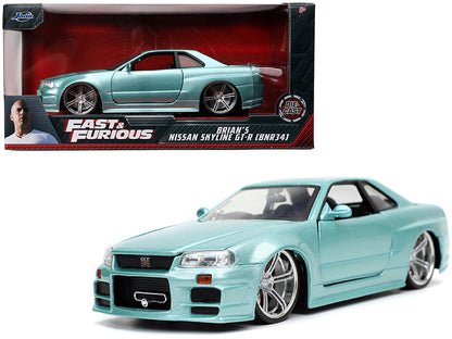 Light blue model car of Brian's Nissan Skyline GT-R from 'Fast & Furious' in packaging.