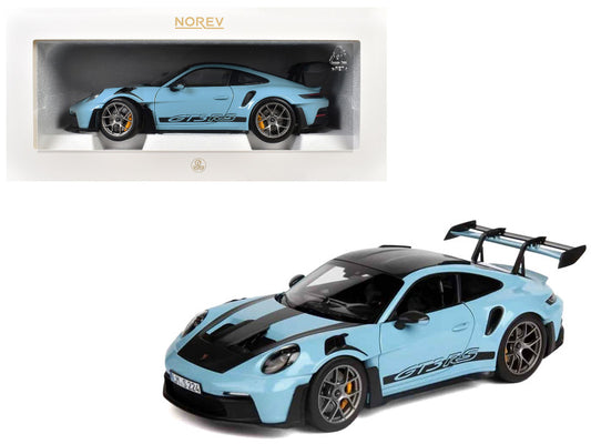 Model car of a sports car in a display case with Norev branding.