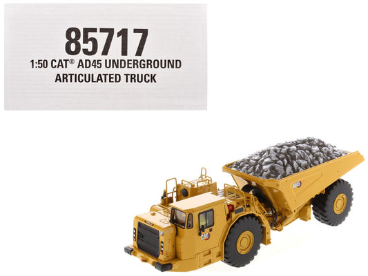 Model of a CAT AD45 Underground Articulated Truck with cargo on a white background