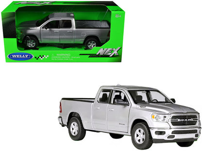 A silver 2019 Dodge Ram 1500 Pickup Truck diecast model car with its original packaging.
