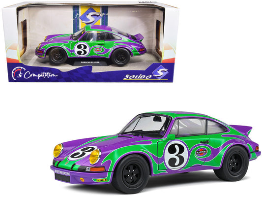 A 1973 Porsche 911 RSR diecast model car in purple with number 3 and sponsor decals, in its original packaging.
