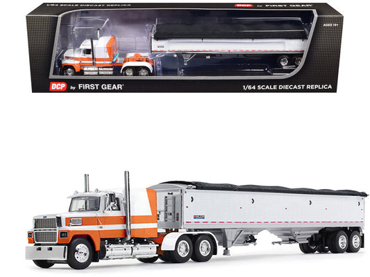 A 1/64 scale die cast model of a Ford LTL 9000 Sleeper truck with an Aerodyne sleeper cab and a Wilson Pacesetter Grain Trailer in orange and white colors, showing the model with its box packaging.
