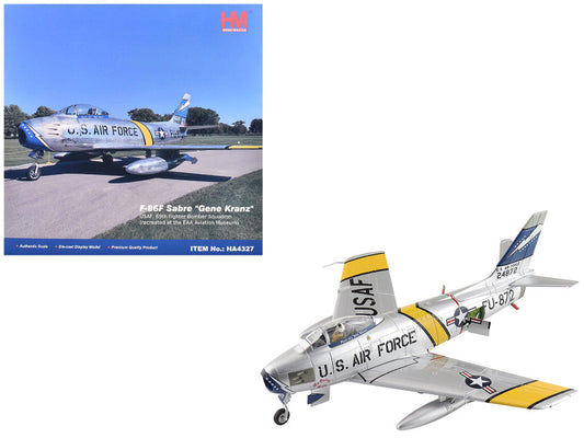 Model of a U.S. Air Force F86F Sabre with a book on the left about the same model.