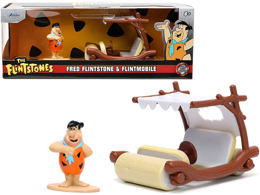 Diecast model of Flintmobile car from The Flintstones with Fred Flintstone figurine, packaged in a box.