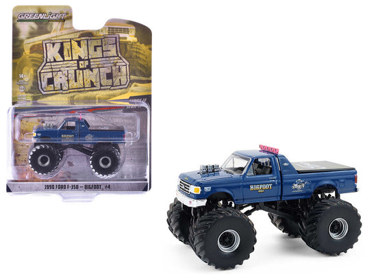 Blue monster truck with oversized wheels next to its packaging on a white background