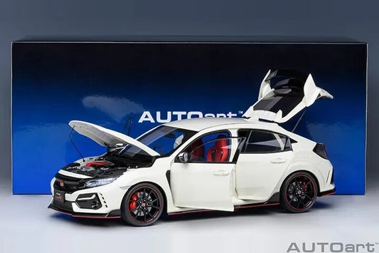 White model car with open doors and hood on a blue AUTOart display box