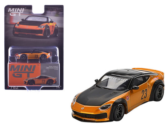 Orange and black toy car with 'MINI GT' packaging on a white background