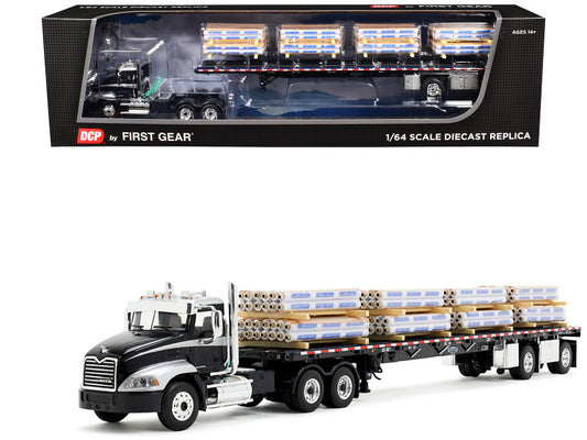 A 1/64 scale diecast model of a Mack Pinnacle Day Cab with a flatbed trailer loaded with pallets, predominantly in black with silver accents.